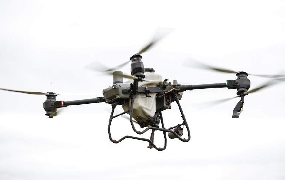Een drone met thermische camera inspecteert een nutsvoorziening in de lucht, met duidelijke warmtemapping.